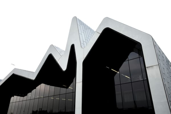 The curved, wave-like metal roof of the Riverside Museum in Glasgow